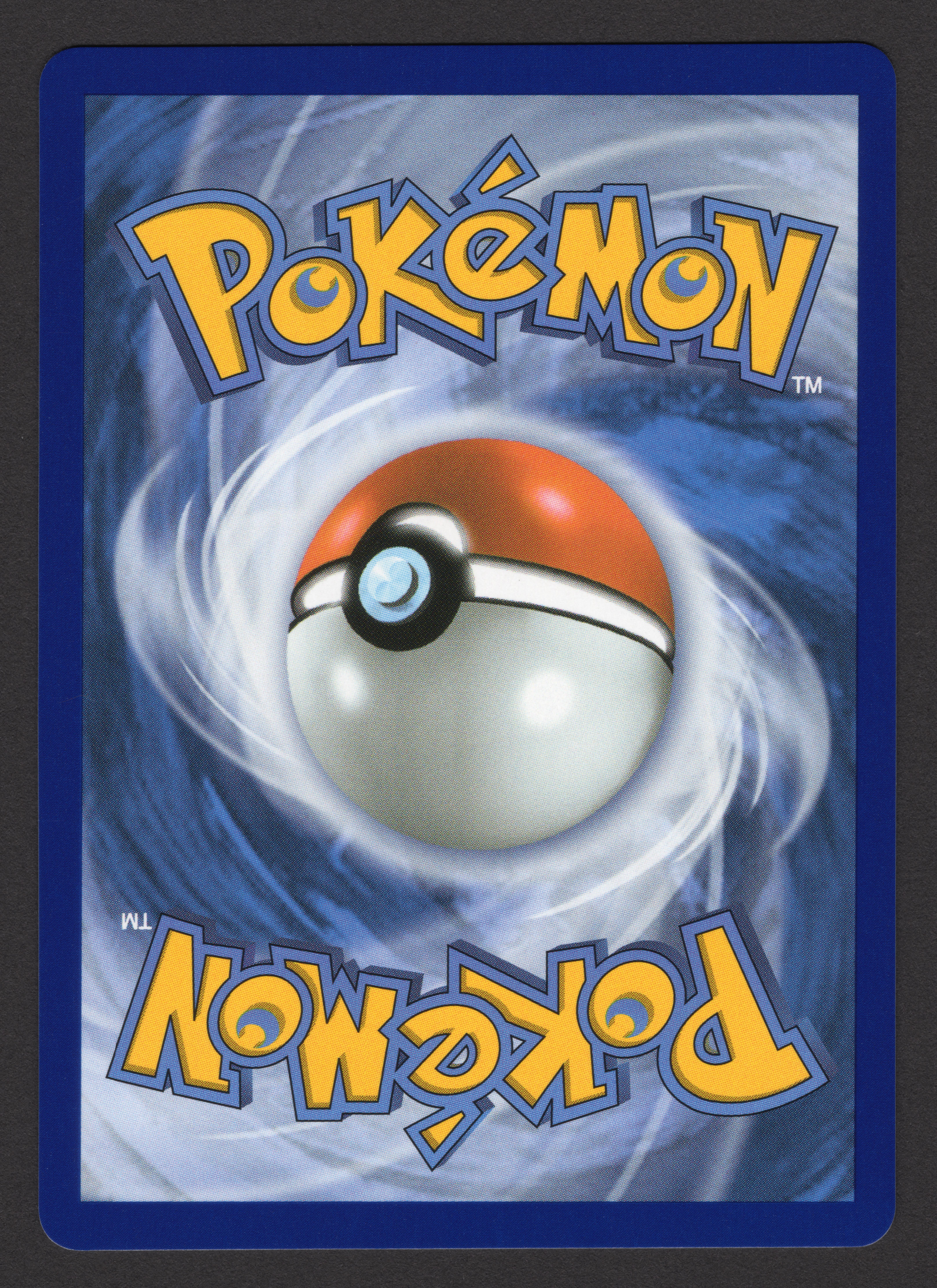 Pokemon card back showing clean centering — the back of a card is graded to the same standard as the front