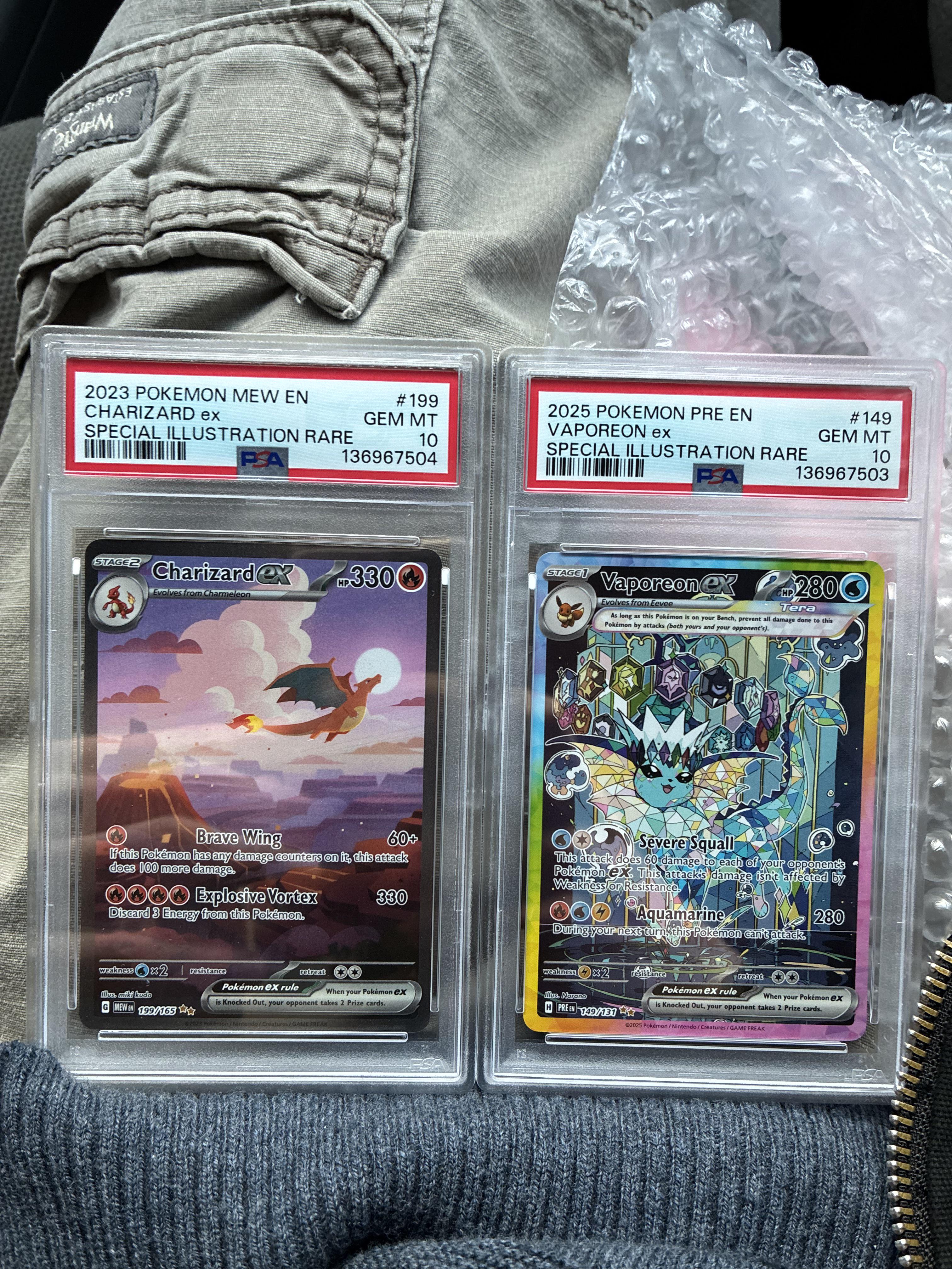 PSA 10 Gem Mint Charizard ex SIR and Vaporeon ex SIR — the end result of a successful PSA submission